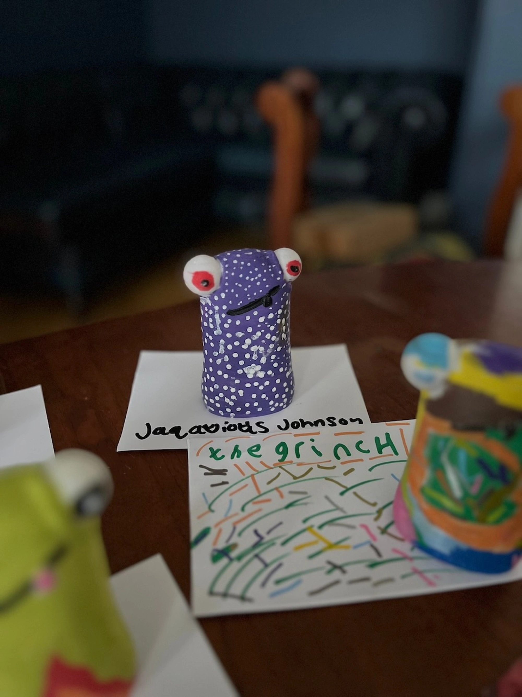 Purple and spotty Clyde figure called The Grinch