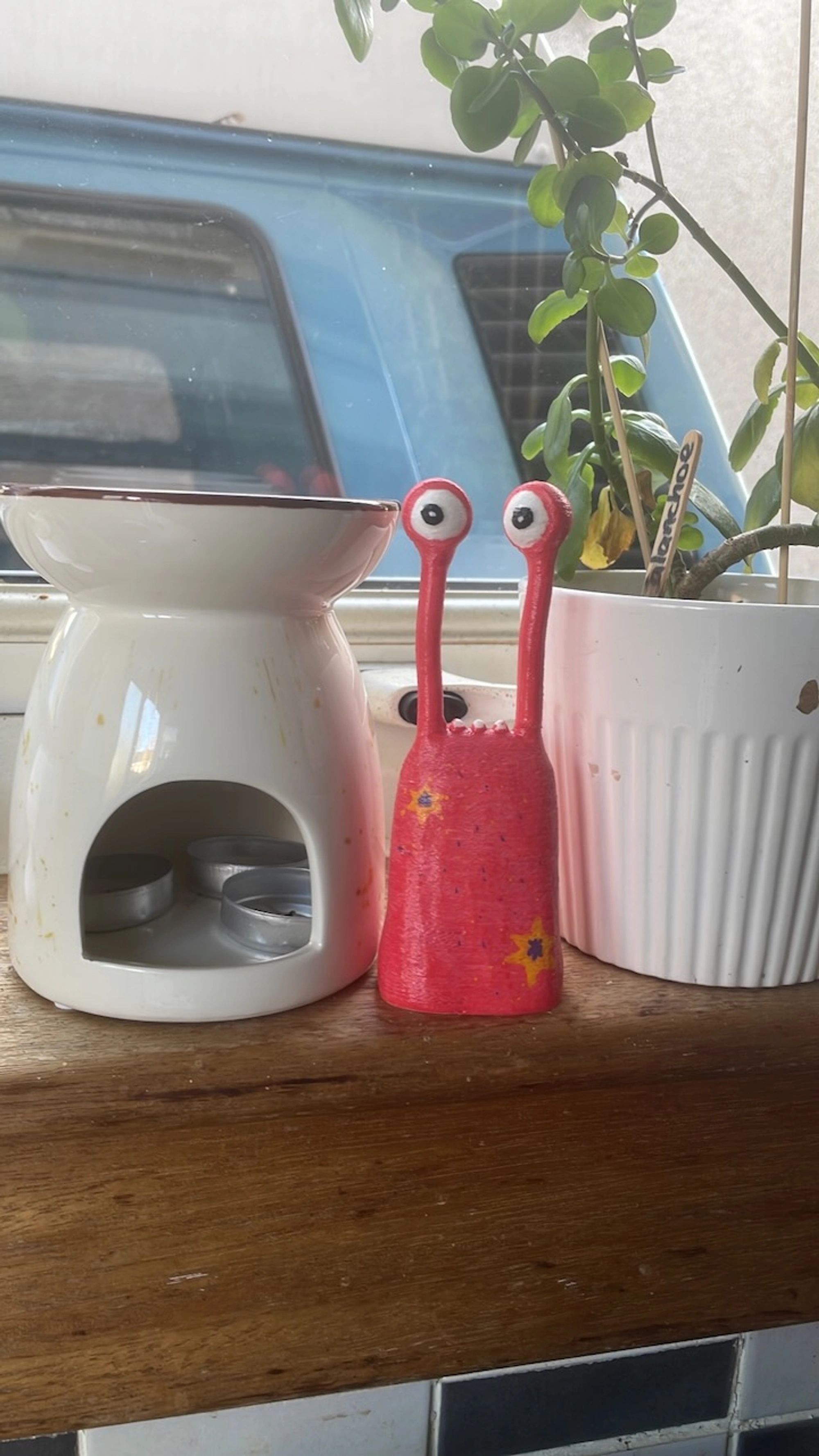 Derek figure by a campervan