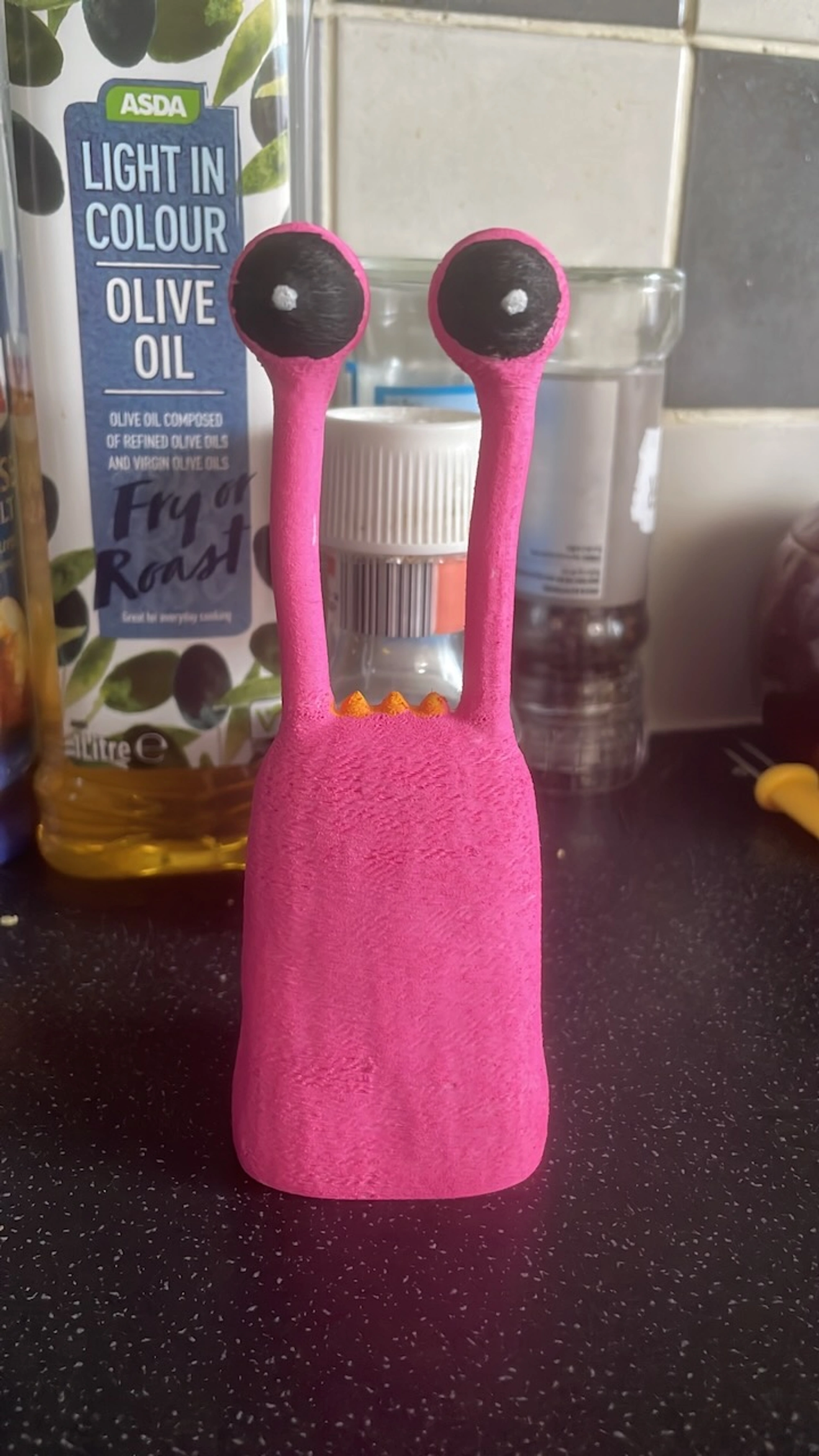 Pink coloured Derek figure