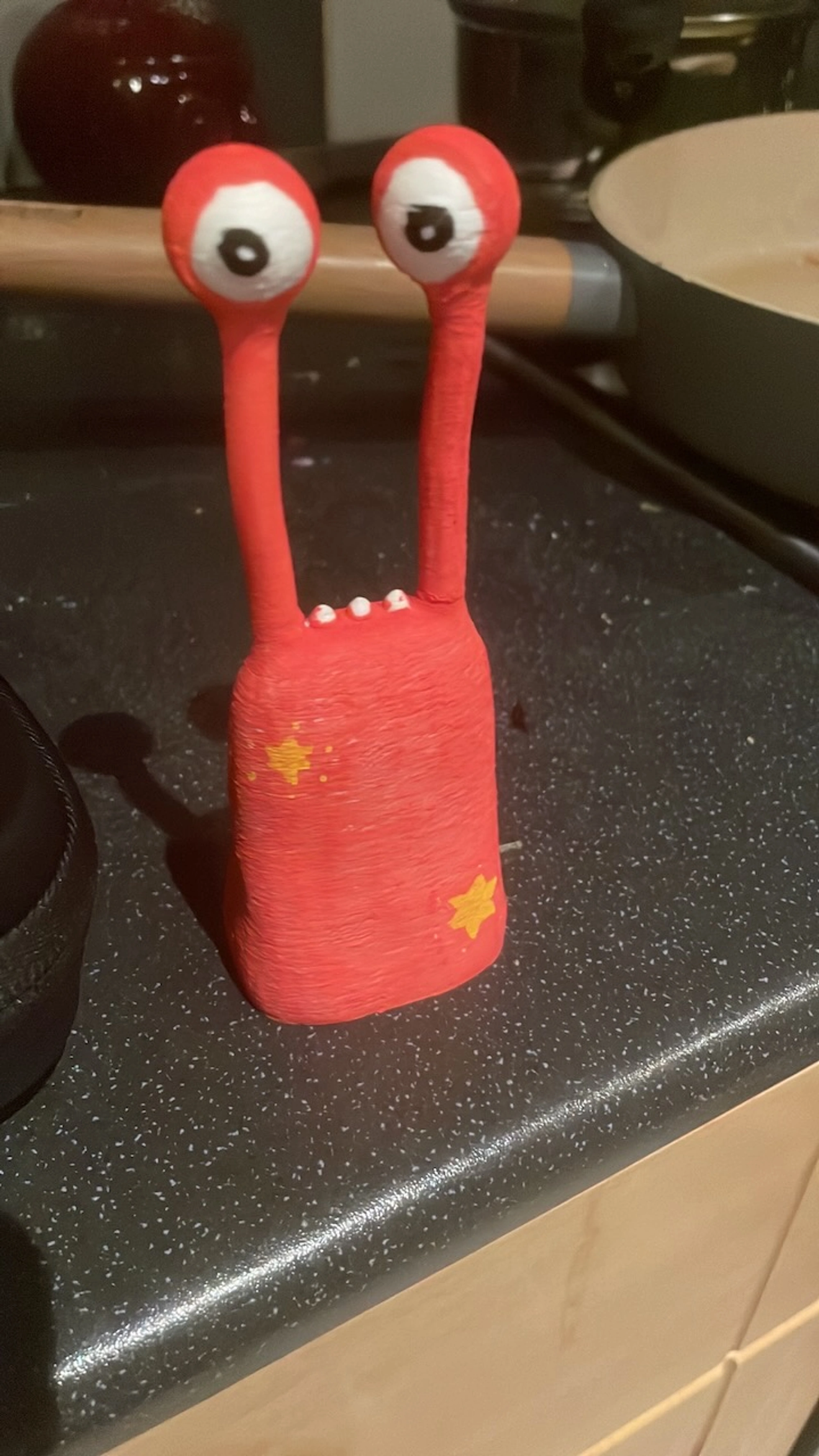 Derek figure with star pattern on red background